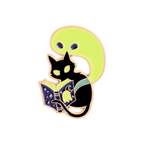 A stylized enamel pin featuring a black cat reading a glowing book on a white background