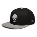 A black snapback cap with a contrasting light gray flat brim, featuring an embroidered white skull on the front and 'OKETO DESIGN' text on the side, set against a solid white background