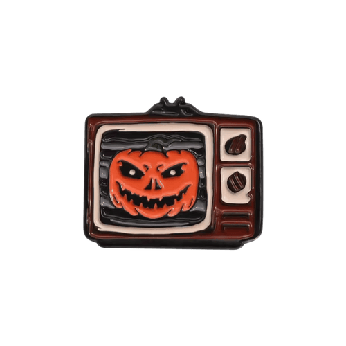 A retro TV-shaped enamel pin featuring an orange jack-o'-lantern on a white background