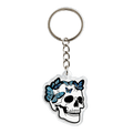 A skull-shaped acrylic keychain with blue butterflies and chain, and split ring clip on a white background