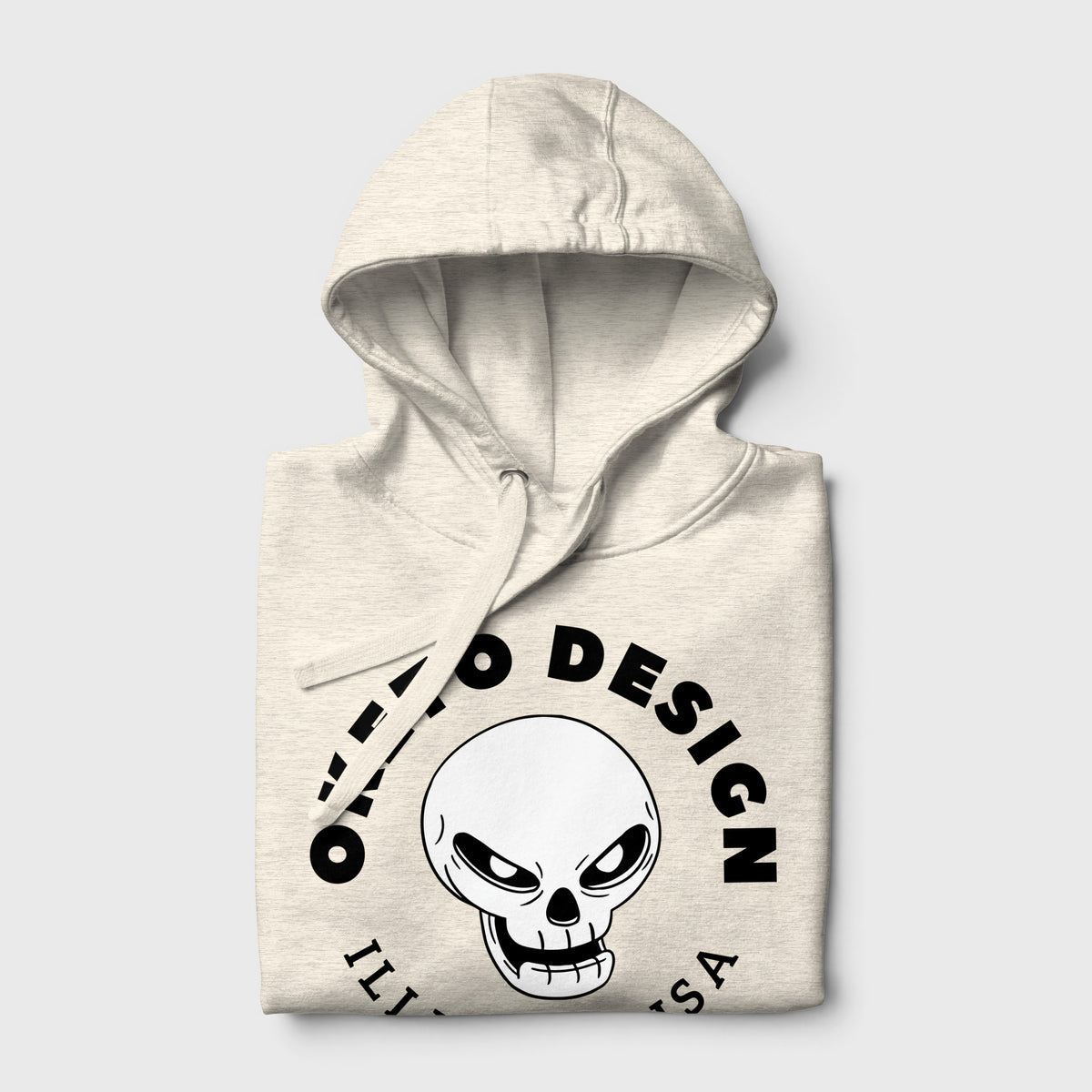 Beige Oketo Design pullover hoodie folded featuring a black skull logo and circular branding on the front