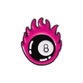 A pin of an 8-ball with pink flames surrounding it on a white background