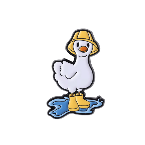 A cartoon duck pin with a white body, yellow bucket hat, yellow rain boots, and a blue puddle on a plain white background