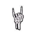 A white and black enamel pin shaped like a skeletal hand making the rock on gesture, centered on a solid white background