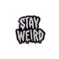 An enamel pin with the words 'STAY WEIRD' in dripping silver letters outlined in black, centered on a solid white background