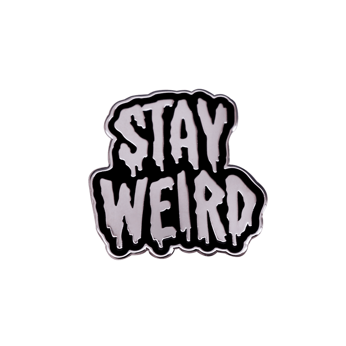 An enamel pin with the words 'STAY WEIRD' in dripping silver letters outlined in black, centered on a solid white background