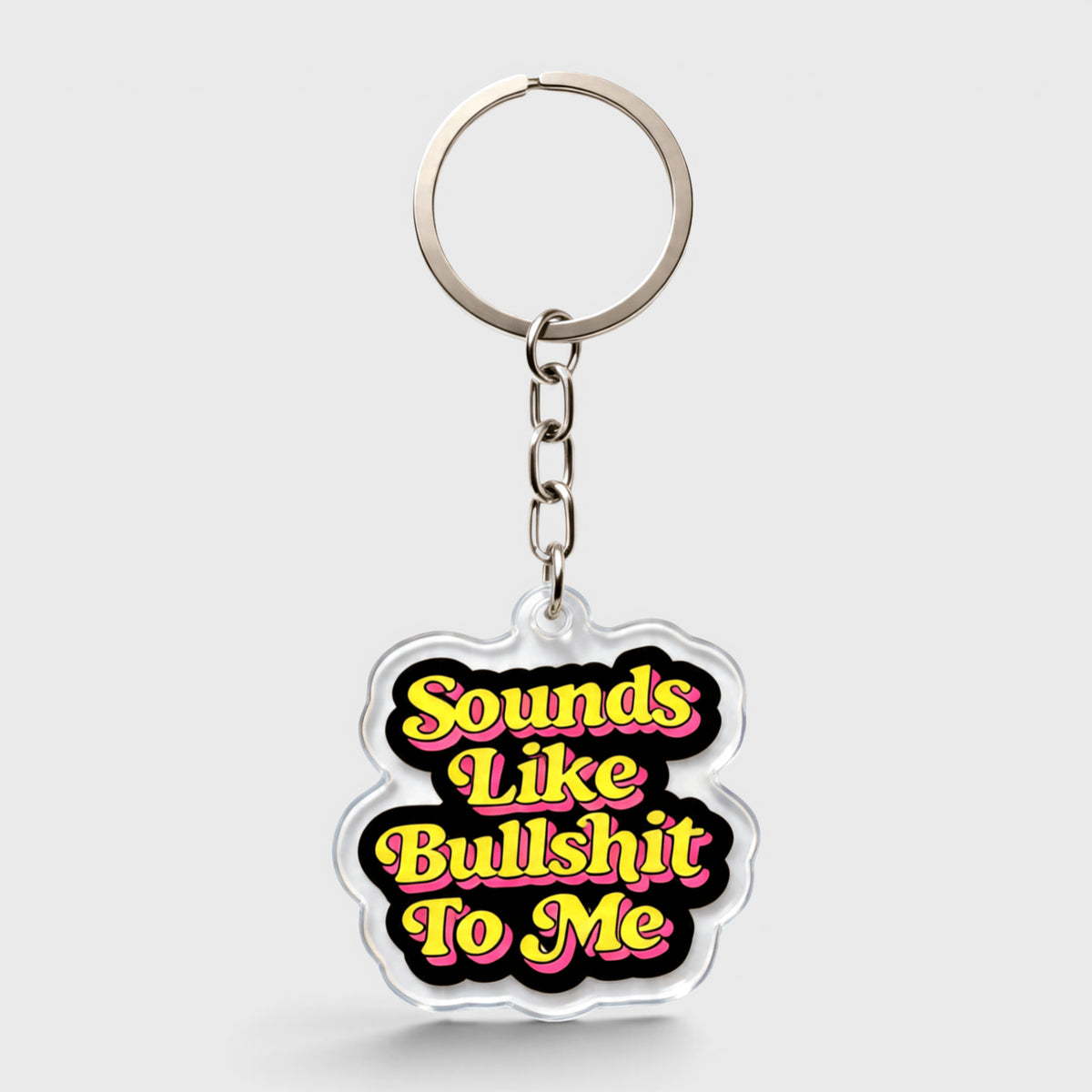 Black and yellow keychain featuring the phrase "Sounds Like Bullshit To Me" in bold lettering