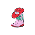 A pair of pink cowboy boots and a red western hat with green details on a white background