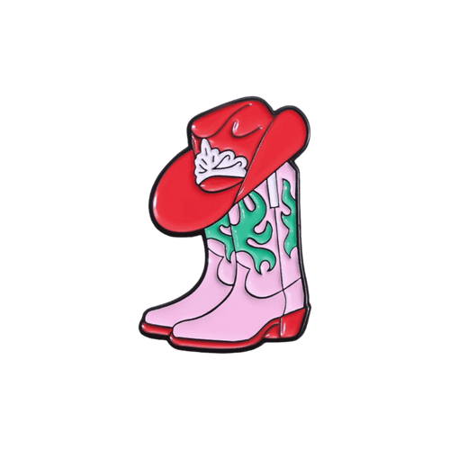 A pair of pink cowboy boots and a red western hat with green details on a white background