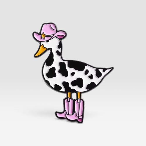Cow-print goose enamel pin featuring pink cowboy boots and a matching pink star hat